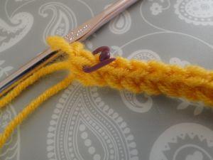 Last stitch with a plastic stitch marker Last stitch with a plastic stitch marker