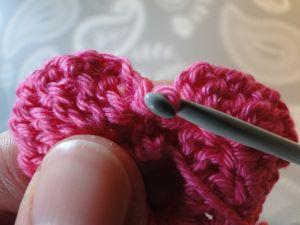 pulling yarn through to back
