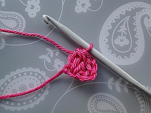 Yarn drawn through all 4 loops. Yarn drawn through all 4 loops.