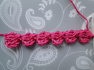 6 pink bobbles worked one after the other 6 pink bobbles worked one after the other