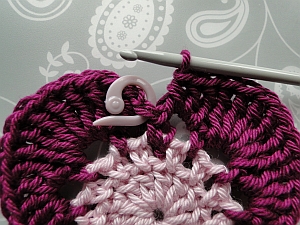 Stitch marker in place showing where to join in and finish