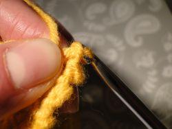 Pulling top loop through bottom loop