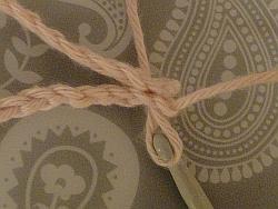 pull yarn through the two stitches