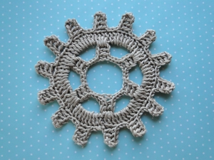 Gray gear in double knitting thread.