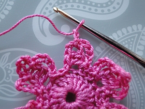 2 ch made, ready to join pink flower to white flower 2 ch made, ready to join pink flower to white flower