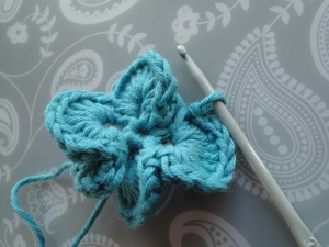 Five petals, and one loop left to work into