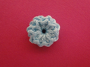 tiny solid light blue flower