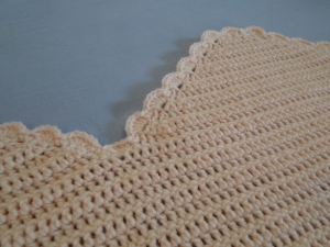 The top middle of the blanket.