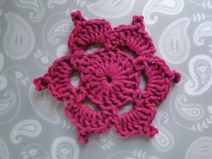 The Picotif worked in aran weight crimson color