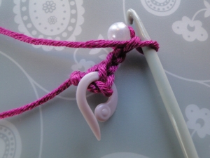 bead secured by chain