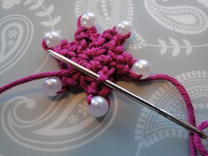 weaving tail end into back of next star point