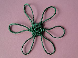 Green flower with 6 big green loopy petals