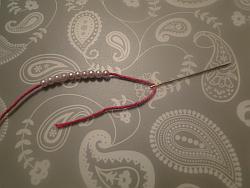 needle, thread and beads needle, thread and beads