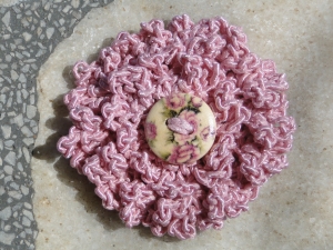 Original flower in pink with flowery button in the middle