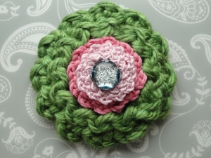 Three different sized flowers one on top of the other Three different sized flowers one on top of the other