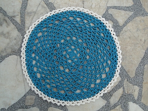 Rep Doily in two colors: warm teal and a cream edging.