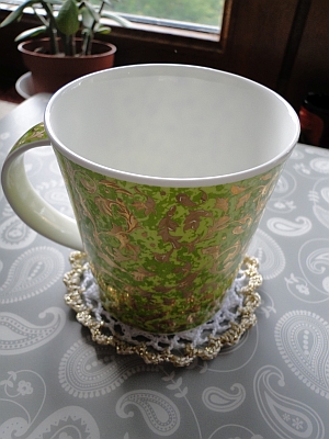 The Royal Coaster with a mug