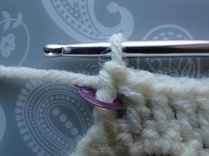 Stitch marker showing where to make the ss