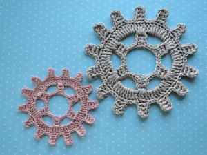 Two steampunk gear wheels next to each other.